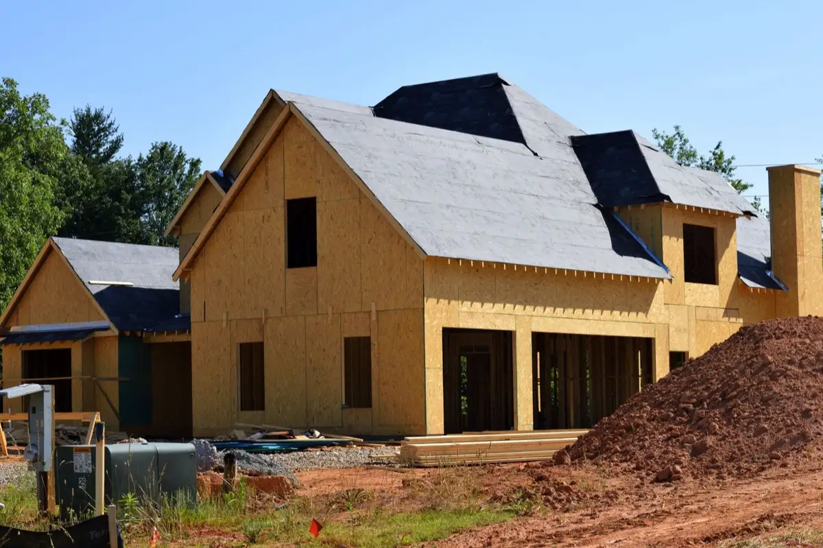 House with new roof decking and synthetic underlayment during a roof replacement in Cary, NC